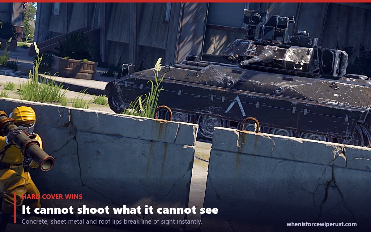 Player taking cover behind concrete barriers from the Bradley APC in Rust