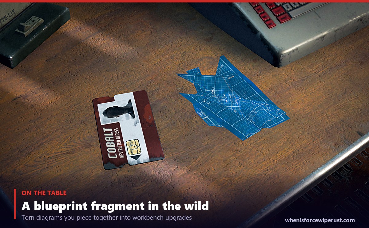 A basic blueprint fragment beside a C4 blueprint and a red keycard on a table in Rust, showing what blueprint fragments look like in the game