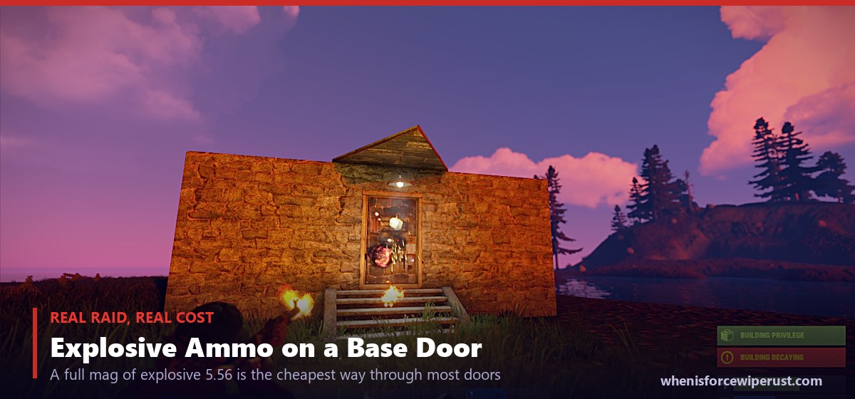 In-game Rust screenshot of a player raiding a base door with explosive 5.56 ammo at sunset